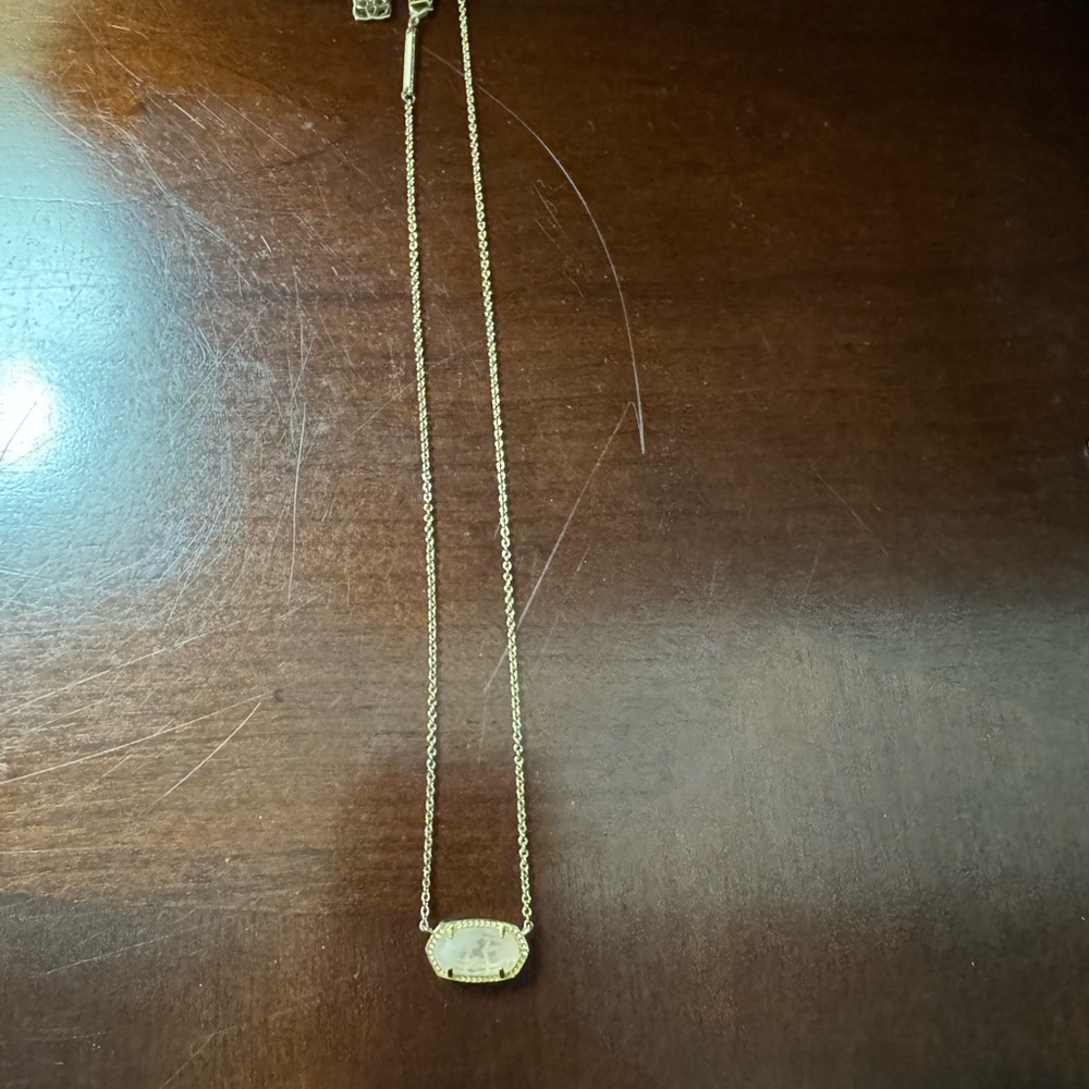 Kendra Scott necklace. Gold chain with vanilla colored stone.